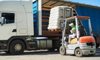 a forklift loading a truck